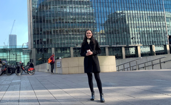 Sophie stands outside the PwC office in Canary Wharf, London	